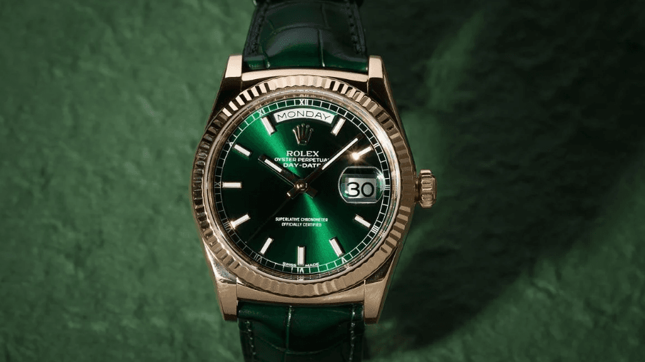 Rolex Day-Date with green dial in yellow gold showing the day and date display