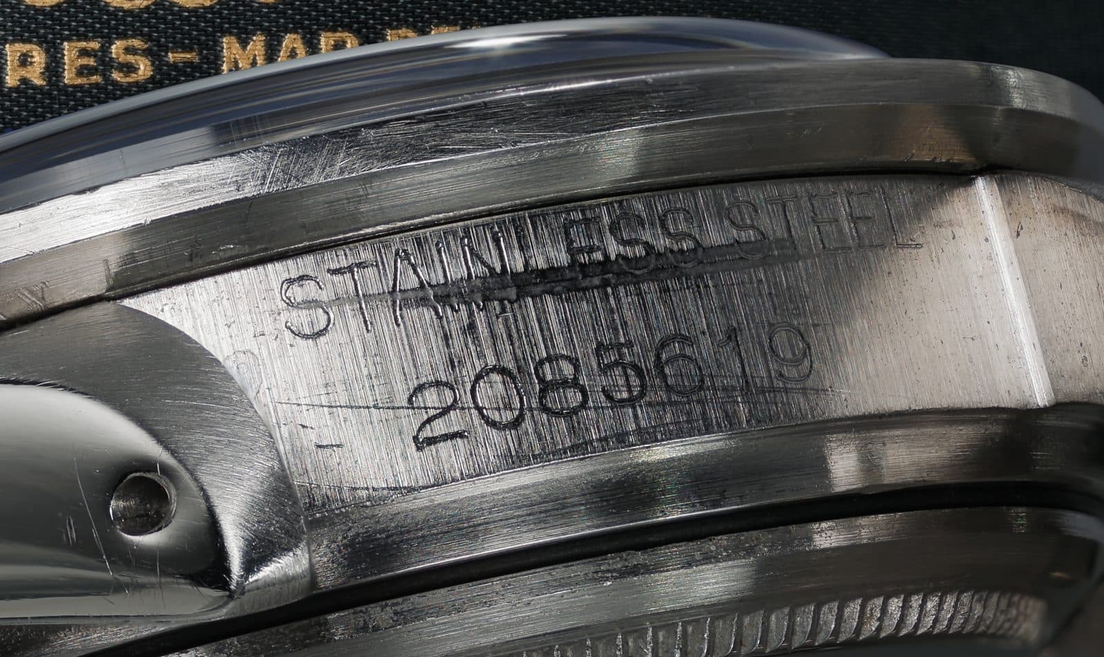 Macro photo of a Rolex reference number engraved on the case between the lugs