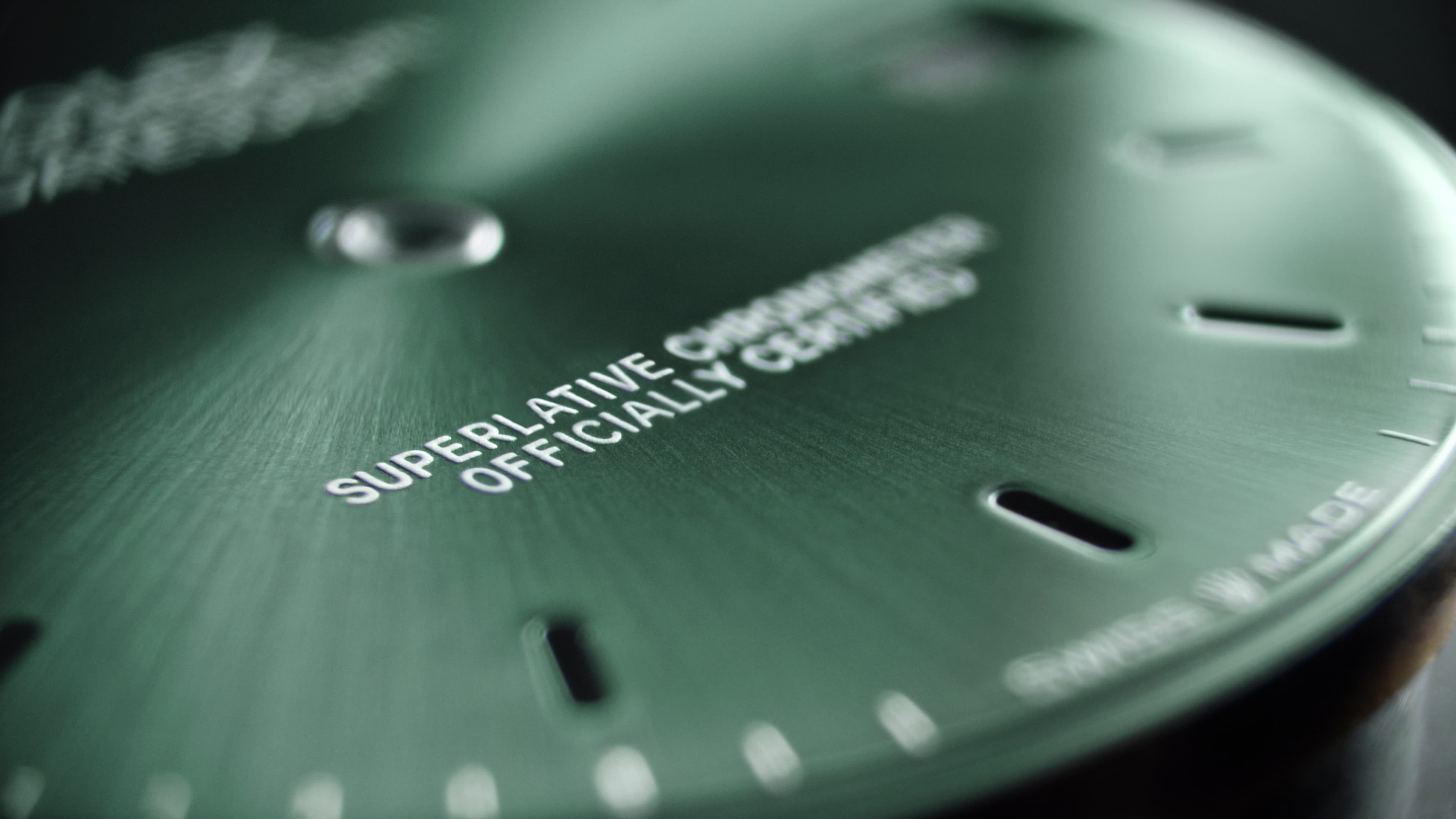 Close-up of a Rolex sunburst dial finish showing how light plays across the surface
