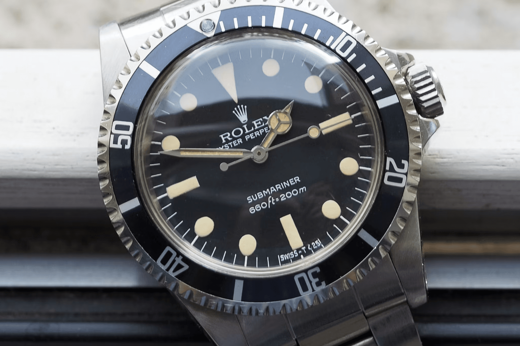 Vintage Rolex Submariner 5513 with patina showing the classic no-date design